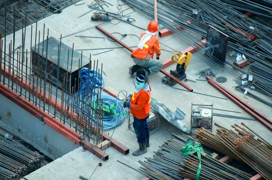 Two construction workers on site